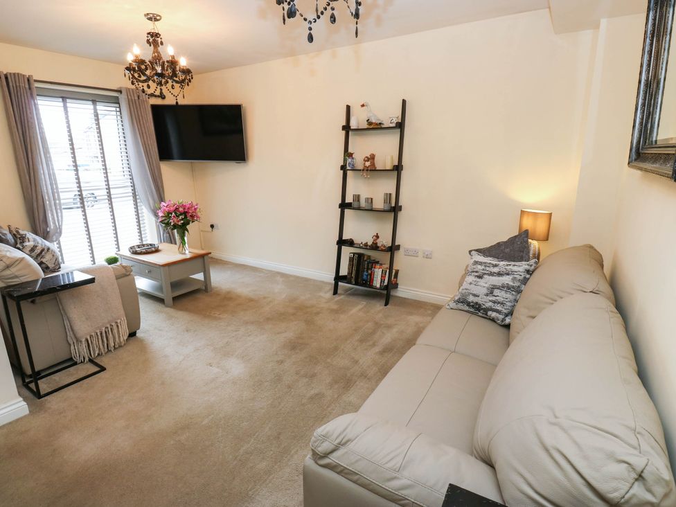 A living room with a sofa and coffee table at Canal House in Shipley
