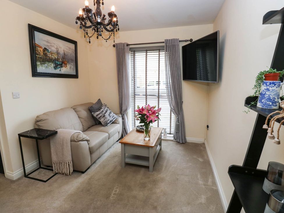 A living room with a sofa and coffee table at Canal House in Shipley