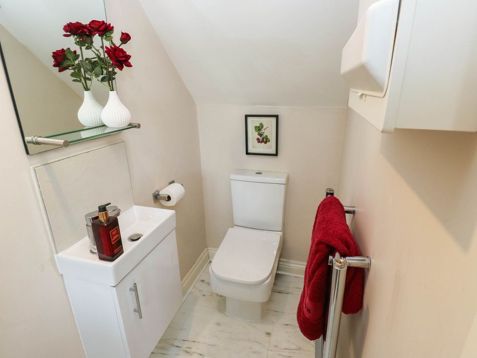 A bathroom with a toilet and sink at Canal House in Shipley