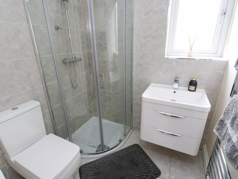 A bathroom with a shower and sink at Canal House in Shipley