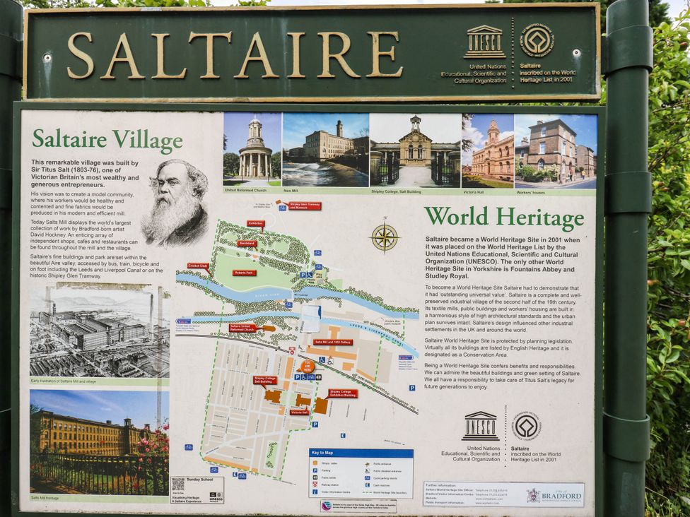 Information sign about Saltaire Village and its World Heritage status at Canal House in Shipley