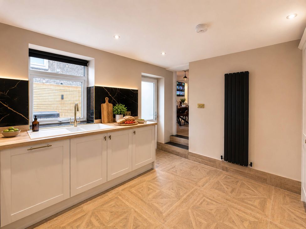 A kitchen with a sink and countertop at Number 8 Llandudno