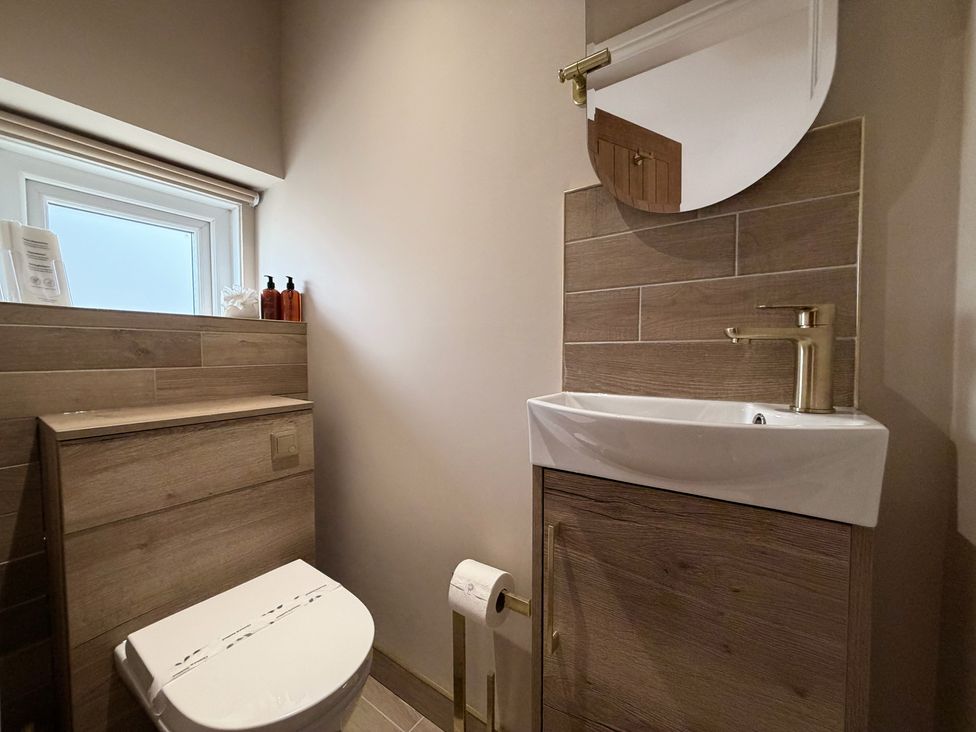A bathroom with a sink and toilet at Number 8 Llandudno