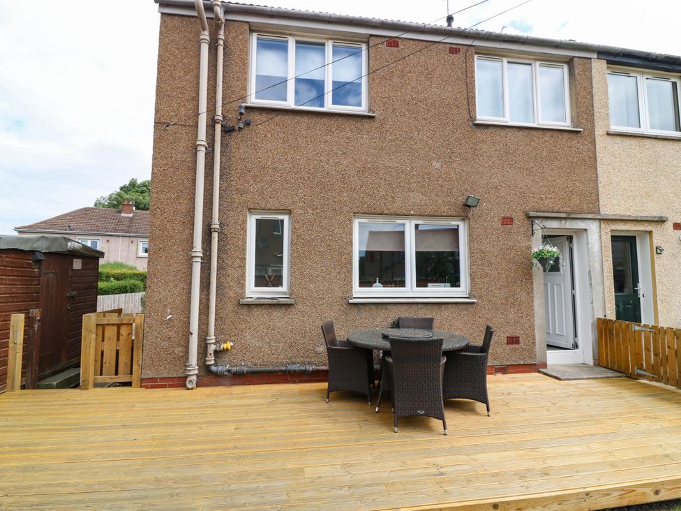 An outdoor seating area with a table and chairs at 6 Niddrie Marischal Road Edinburgh