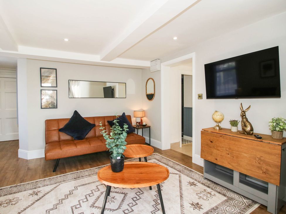 A living room with a sofa and coffee table at The Annex at The Lodge Shawbury