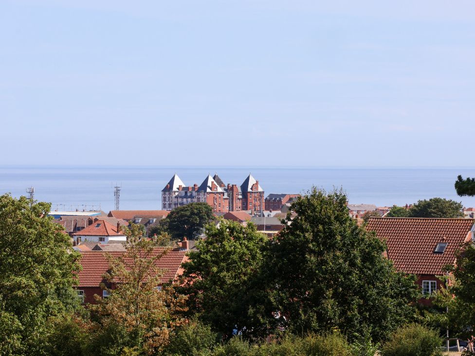 A view of buildings and ocean at 26 Metropole Towers in Whitby