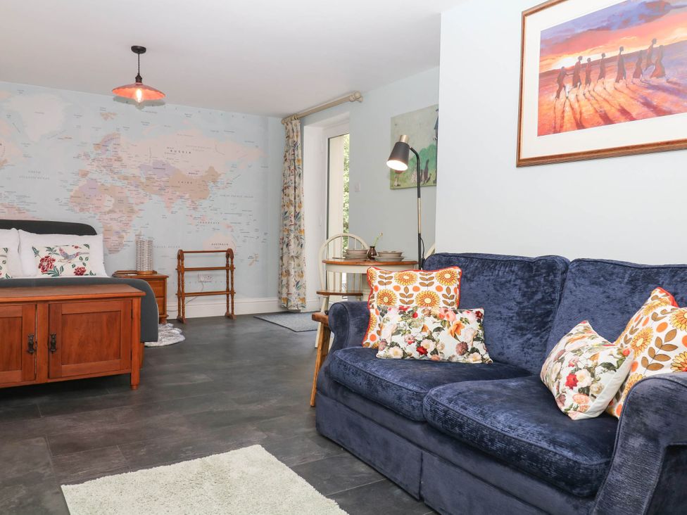 A living room with a sofa and bed at Little Moorgate Okehampton