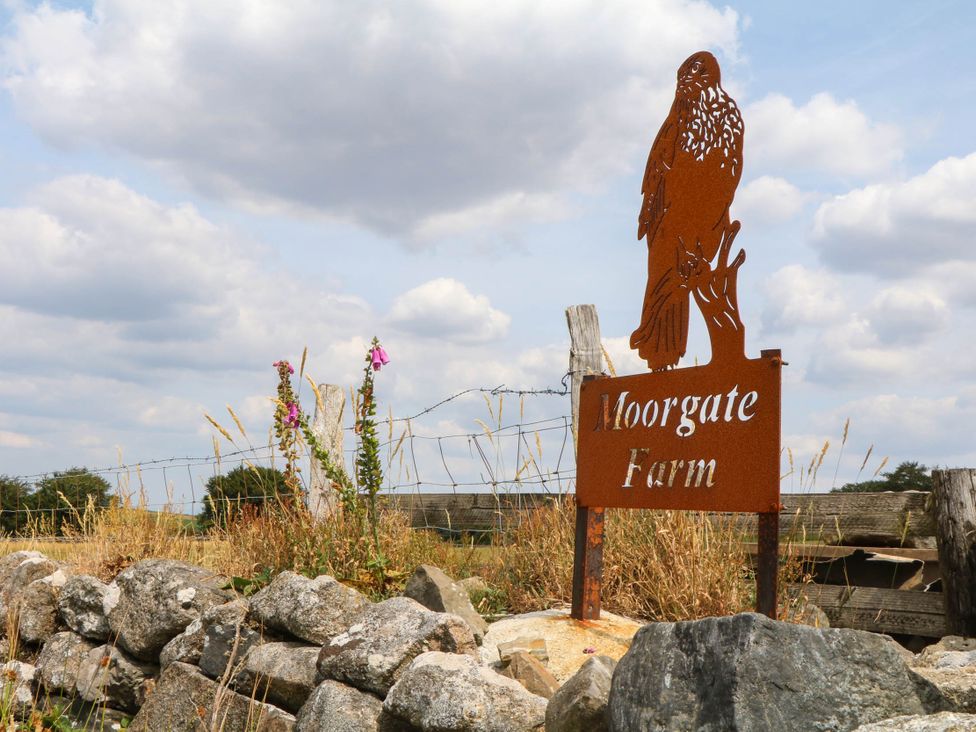 A sign with a hawk sculpture at Moorgate Farm in Okehampton