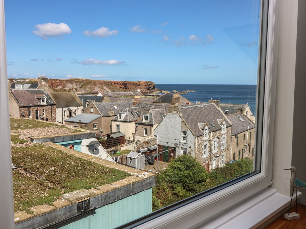 A view of houses and the sea at The Herring's Lean in Eyemouth