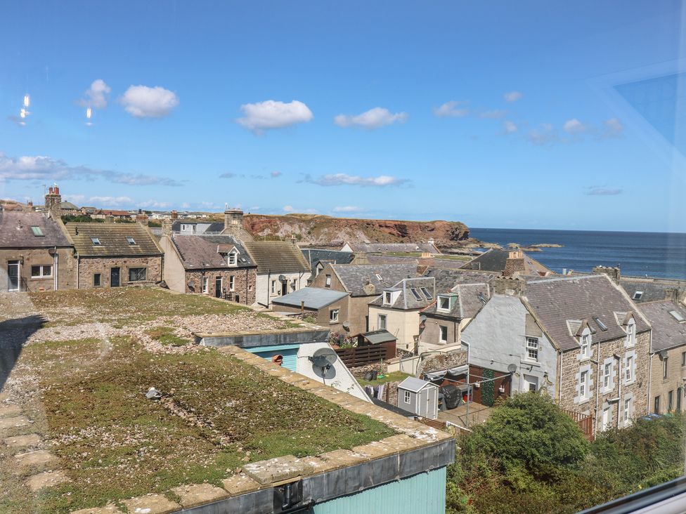 A view of houses and the sea at The Herring's Lean in Eyemouth