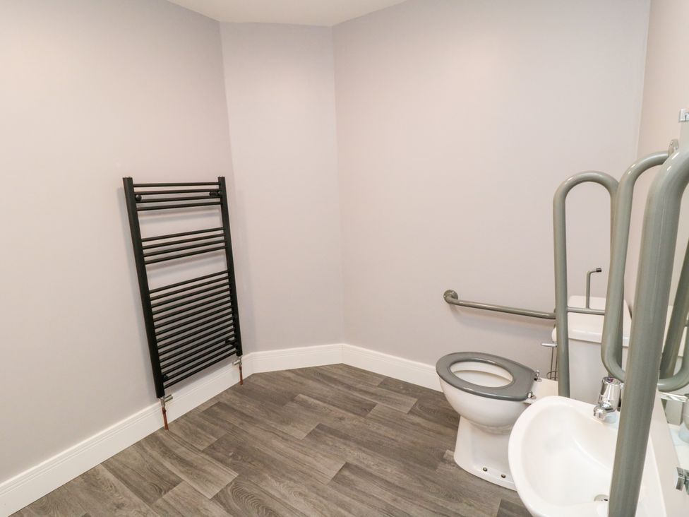 A bathroom with a toilet and sink at Portobell House in Bridlington