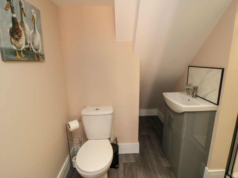 A bathroom with a toilet and sink at Portobell House in Bridlington