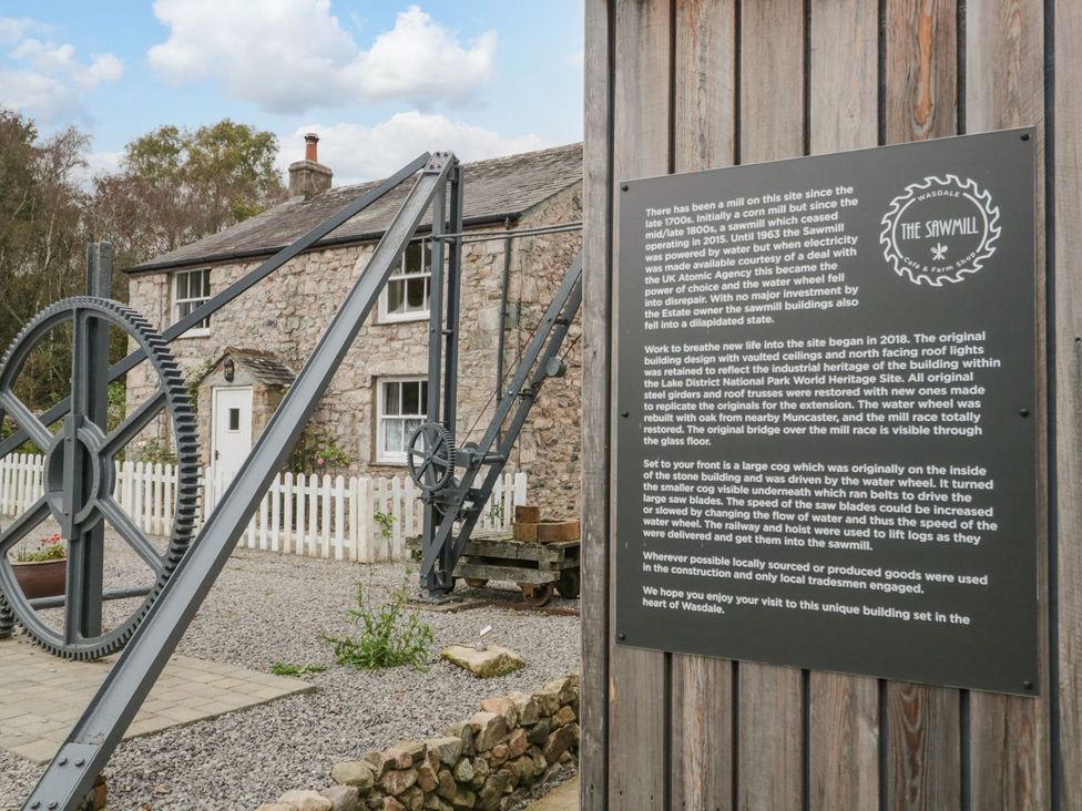 An outdoor view of a sawmill with a water wheel at The Sawmill in Wasdale