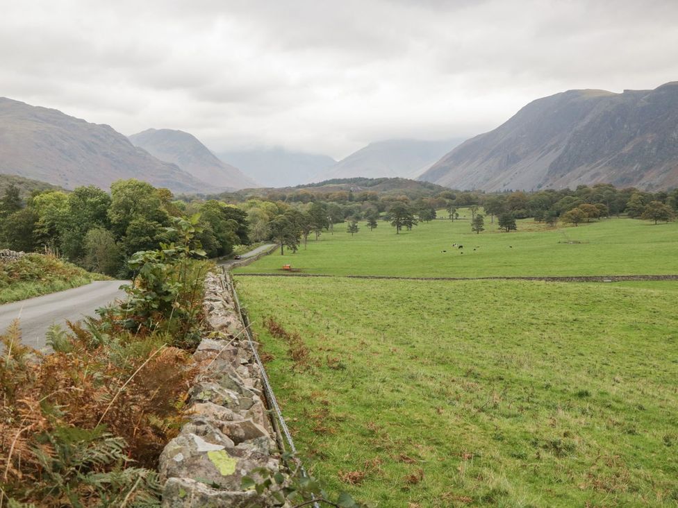 A landscape view with a road and mountains at Irt Cottage Seascale