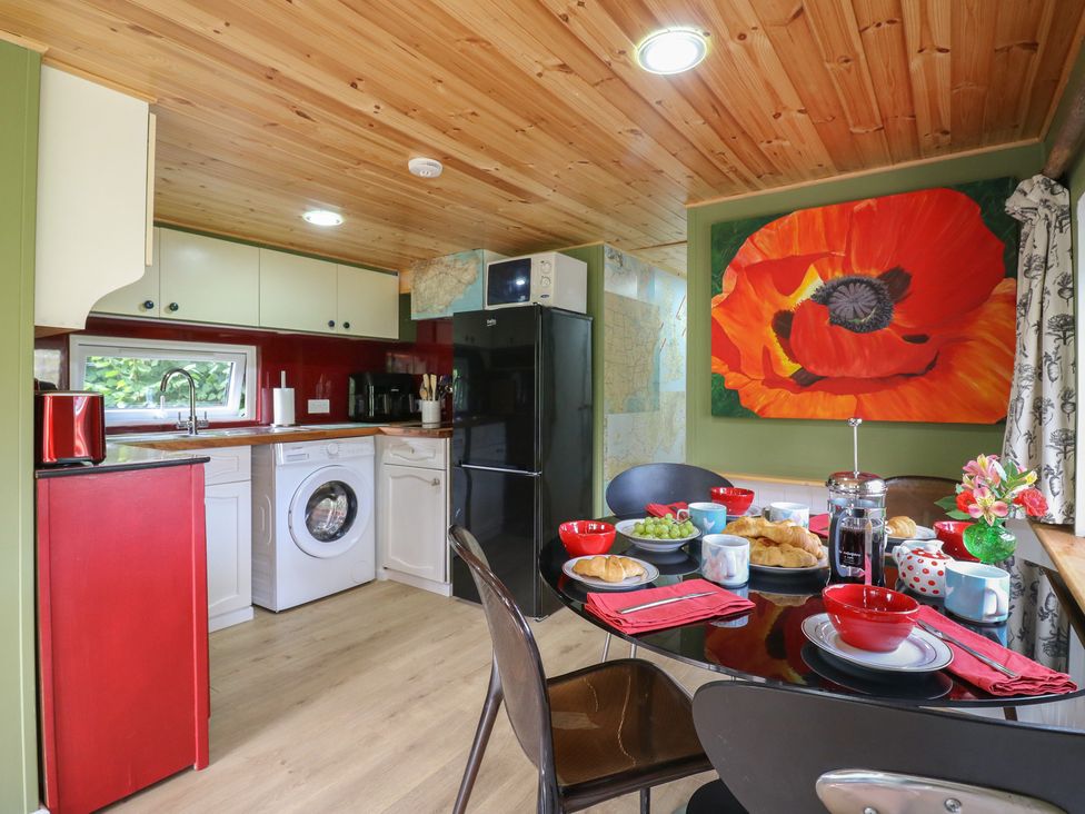 A kitchen with a dining table set for breakfast at Orchard Lodge in Dover