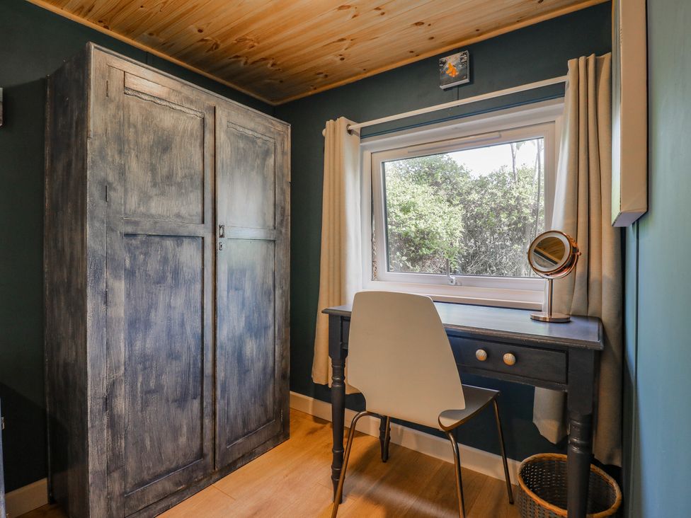 An office with a desk and a wardrobe at Orchard Lodge in Dover