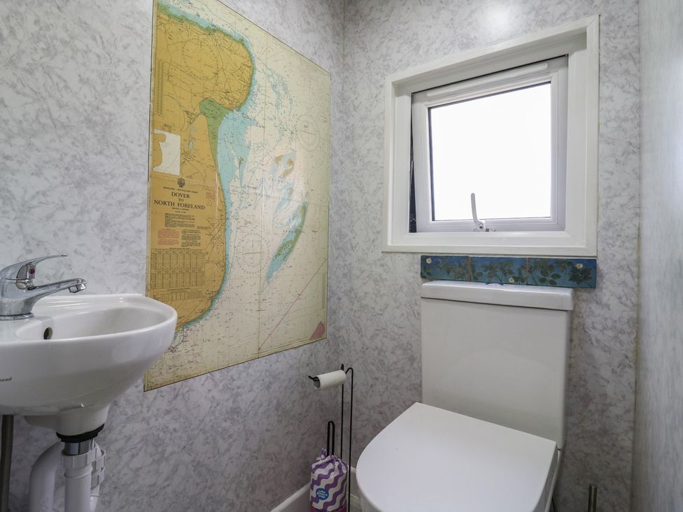 A bathroom with a sink and toilet at Orchard Lodge in Dover