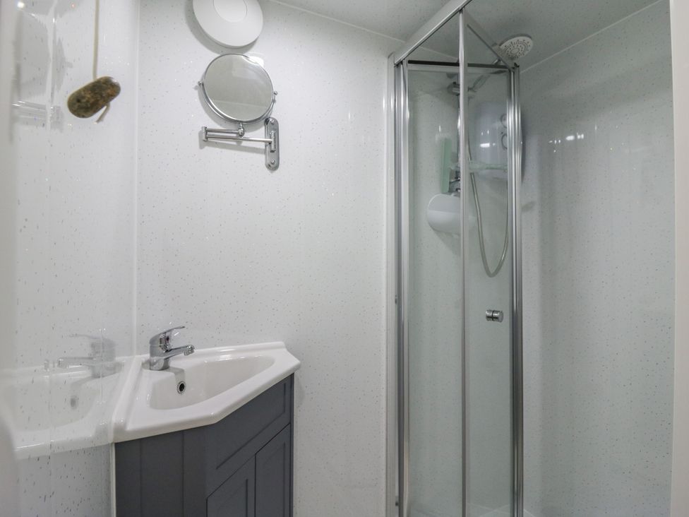 A bathroom with a sink and shower at Orchard Lodge in Dover