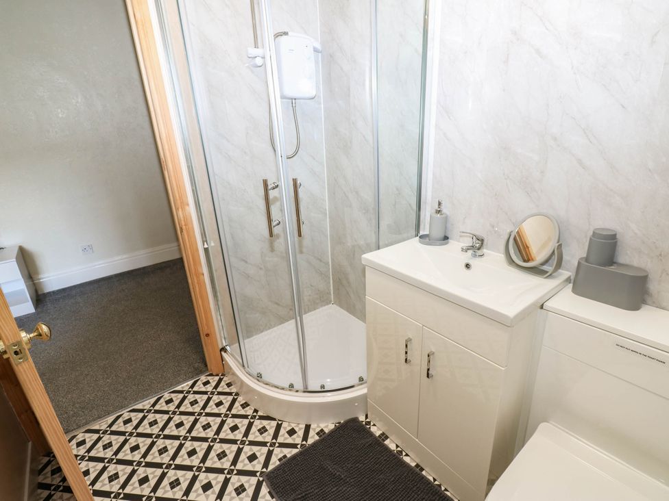 A bathroom with a shower and sink at Prudhoe Cottage in Prudhoe