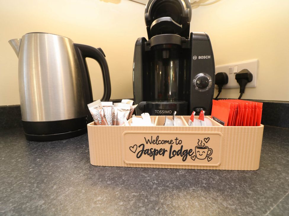 A kitchen with a kettle and coffee machine at Jasper Lodge Welton
