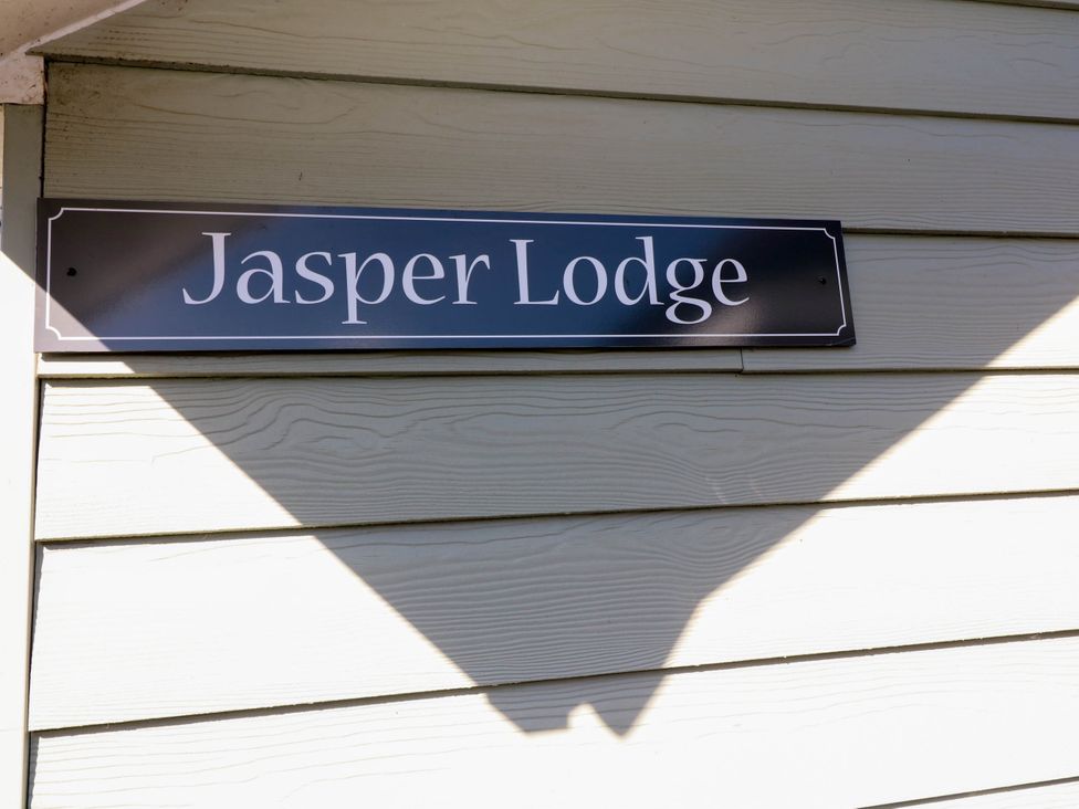 A sign with Jasper Lodge on a wall at Jasper Lodge in Welton