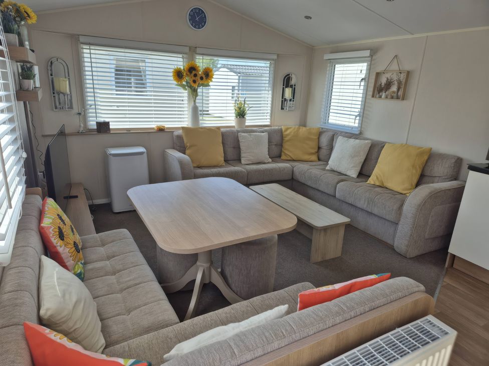 A living room with a sofa and coffee table at 67 Harley Mead in St Leonards-On-Sea
