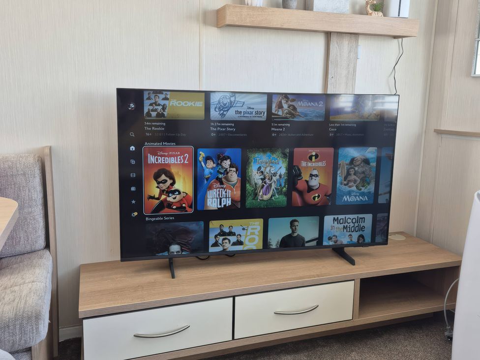 A television displaying animated movies menu at 67 Harley Mead in St Leonards-On-Sea