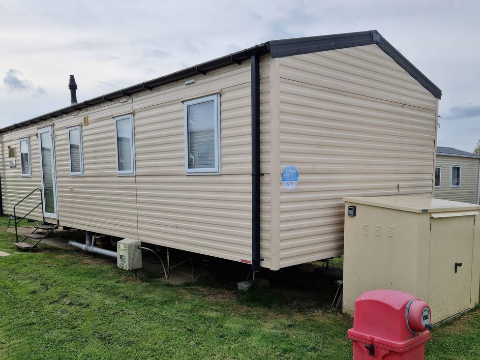 A mobile home with windows and stairs at 67 Harley Mead St Leonards-On-Sea