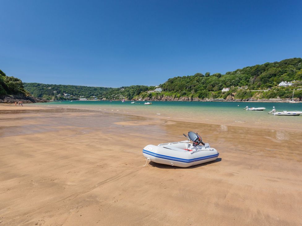 An inflatable boat on the beach at Beachstone in Salcombe