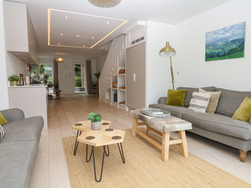 A living room with a sofa and coffee table at Beachstone in Salcombe