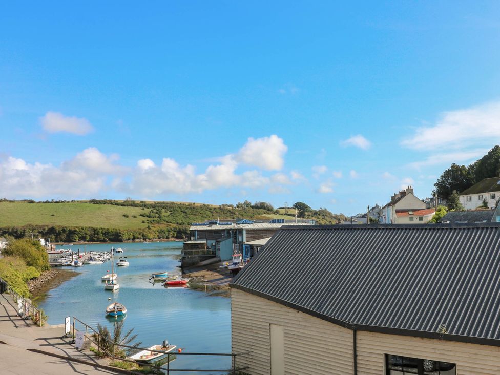 A view of boats on water and buildings by the shore at Beachstone in Salcombe
