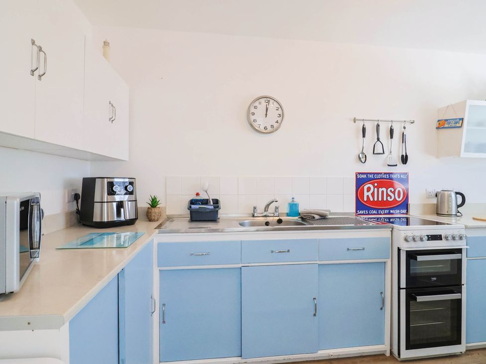 A kitchen with appliances and utensils at 16 Old Shipyard Centre West Bay