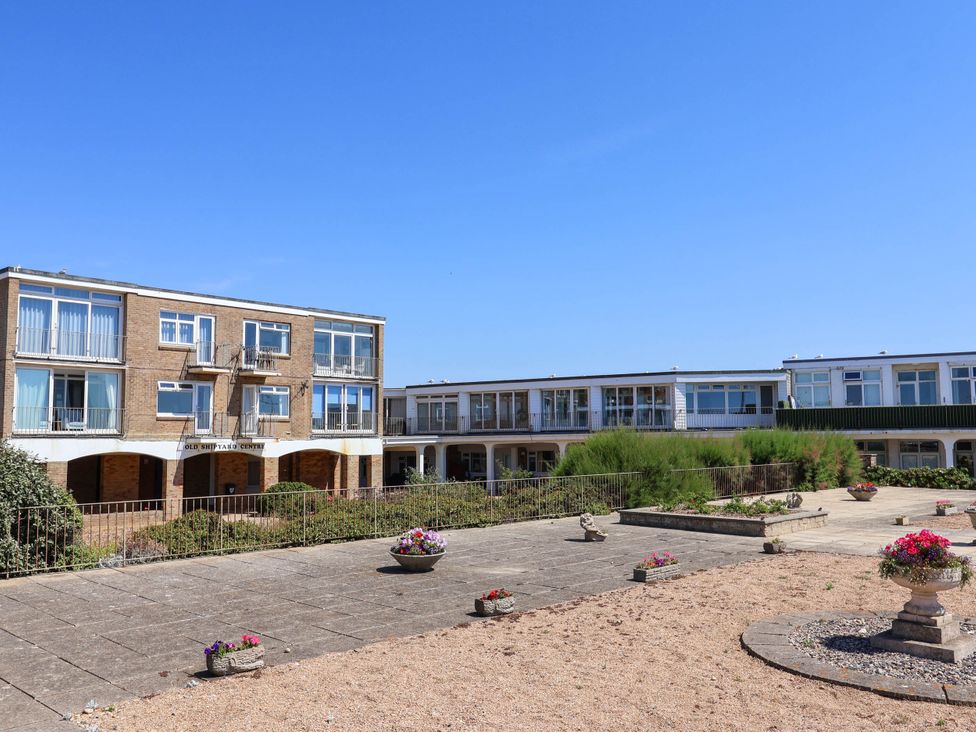 A building complex with gardens at 16 Old Shipyard Centre West Bay