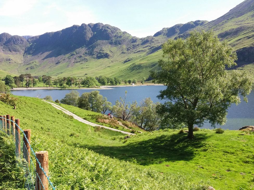 A view of a lake surrounded by mountains at Briargarth in Keswick