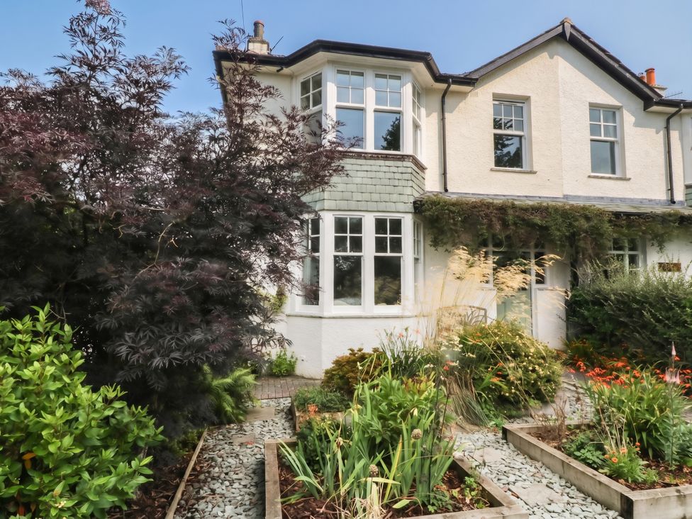 House exterior with garden and flower beds at Briargarth in Keswick