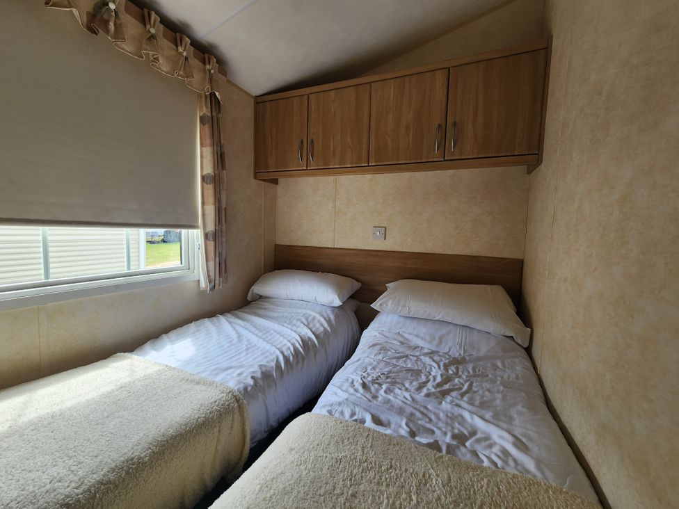 A bedroom with two beds and a window at Whitley bay parkdean resorts - 52 Beechfield, Whitley Bay