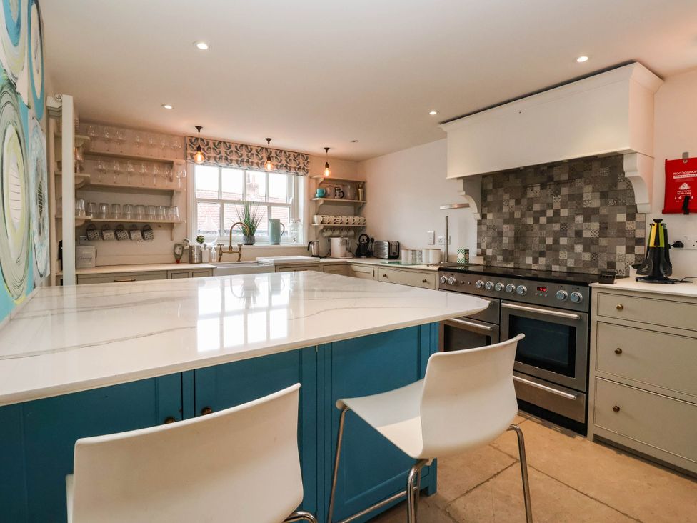 A kitchen with counters and appliances at Cadogan House Easingwold