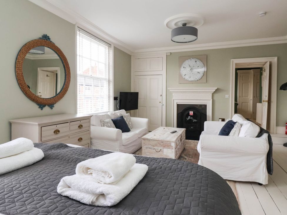 A living room with a sofa and coffee table at Cadogan House Easingwold