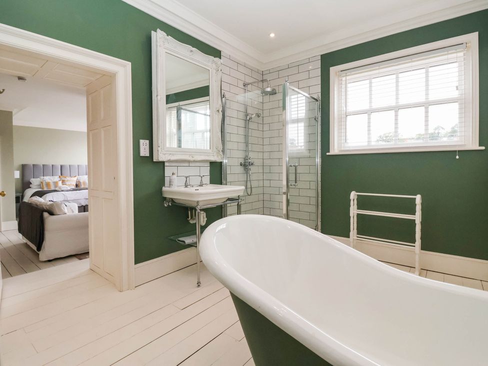 A bathroom with a bathtub and shower at Cadogan House in Easingwold