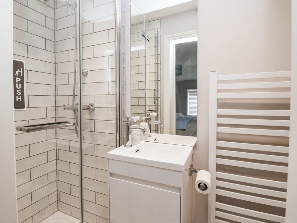 A bathroom with a shower and sink at Cadogan House Easingwold
