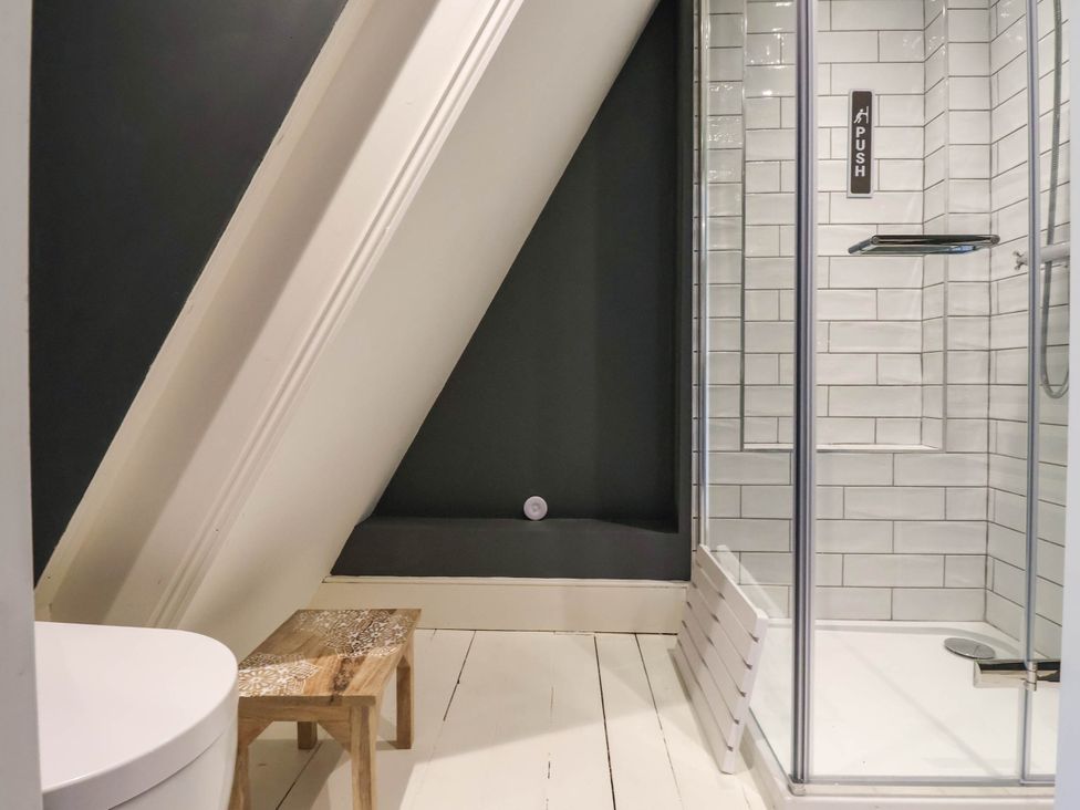 A bathroom with a shower and toilet at Cadogan House in Easingwold