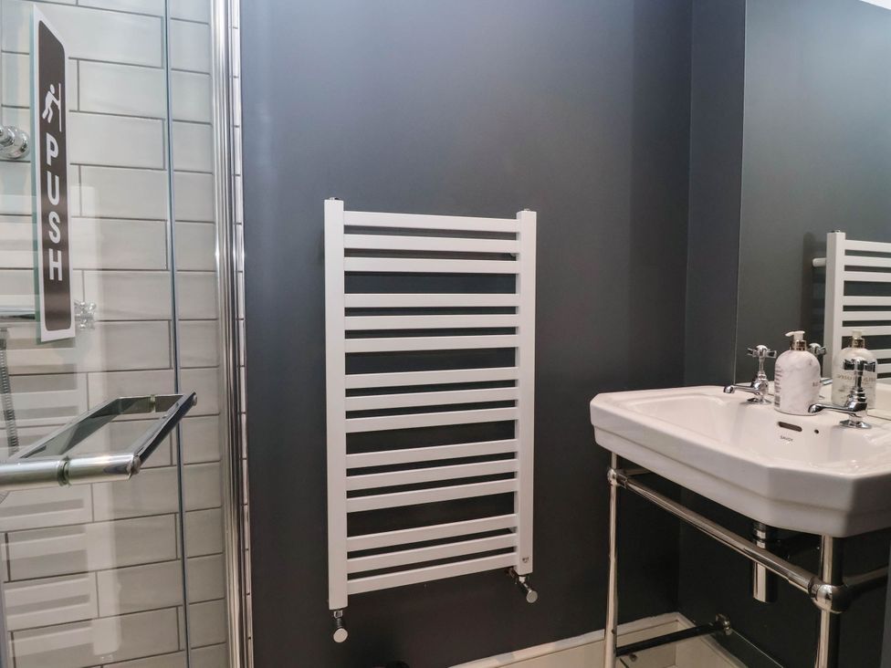 A bathroom with a shower and sink at Cadogan House Easingwold
