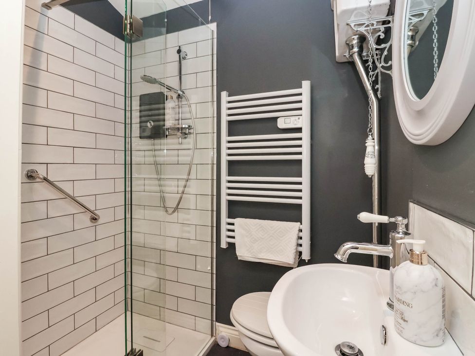 A bathroom with a shower and sink at Cadogan House Easingwold