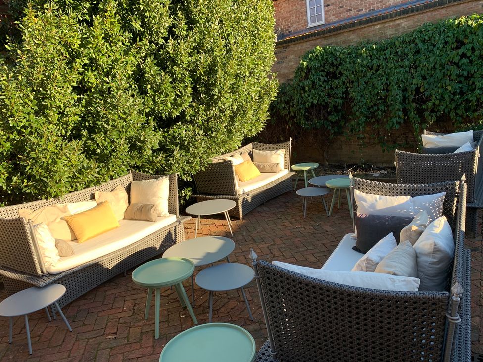 A garden with outdoor sofas and coffee tables at Cadogan House Easingwold
