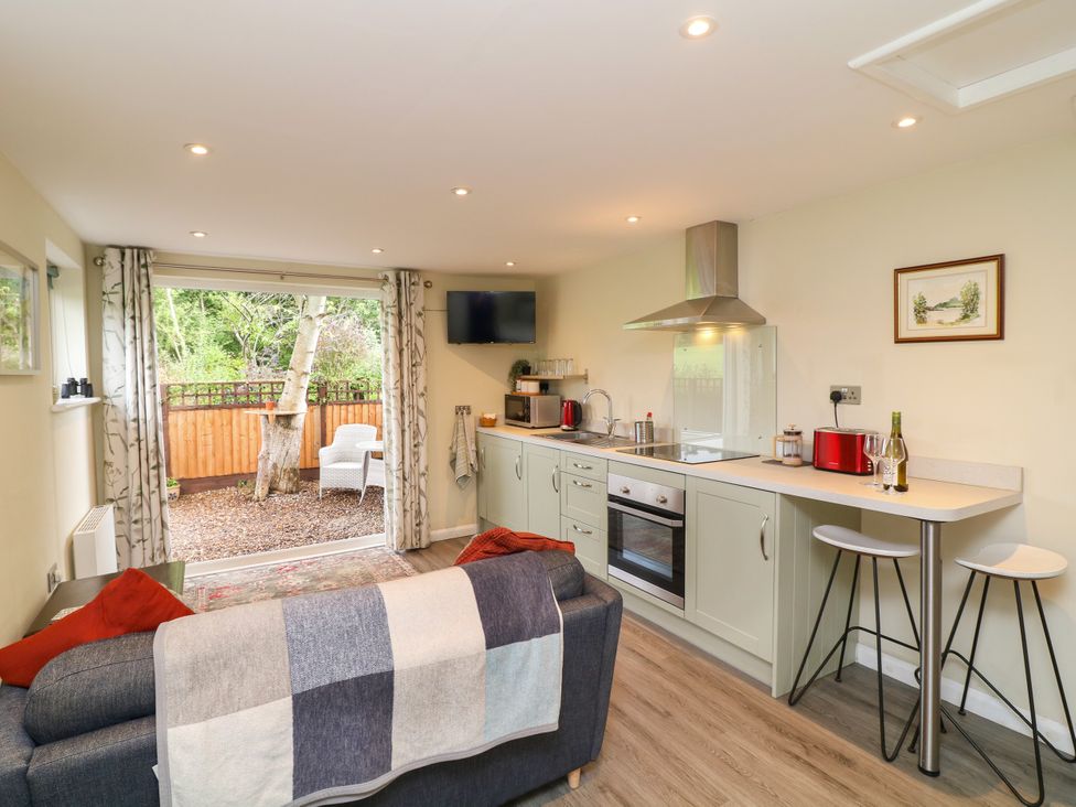 A kitchen with modern appliances and furniture at Lodgeview in Nottingham