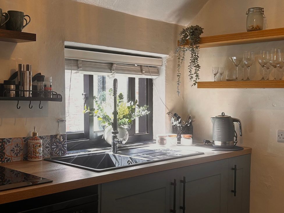 A kitchen with a sink and kettle at Old Cottages: 3 Bed Ripon