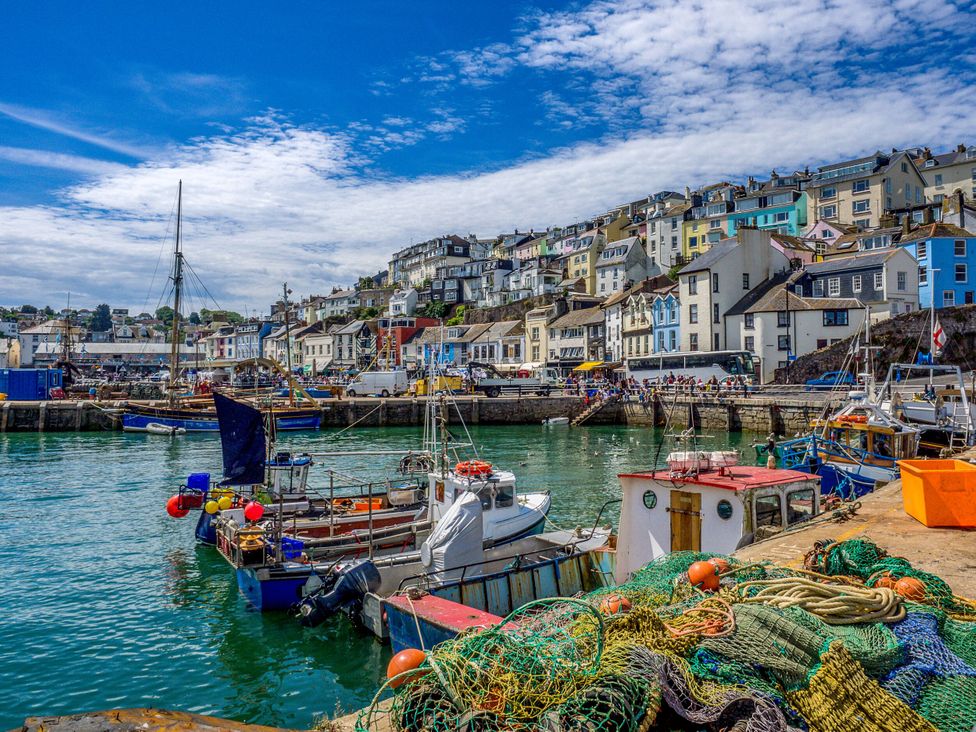 A harbor with boats and fishing nets at Greenswood Mews in Brixham