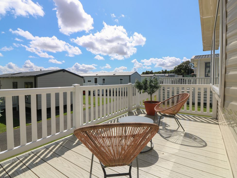 An outdoor area with two chairs and a table at NO. 249 Eyemouth