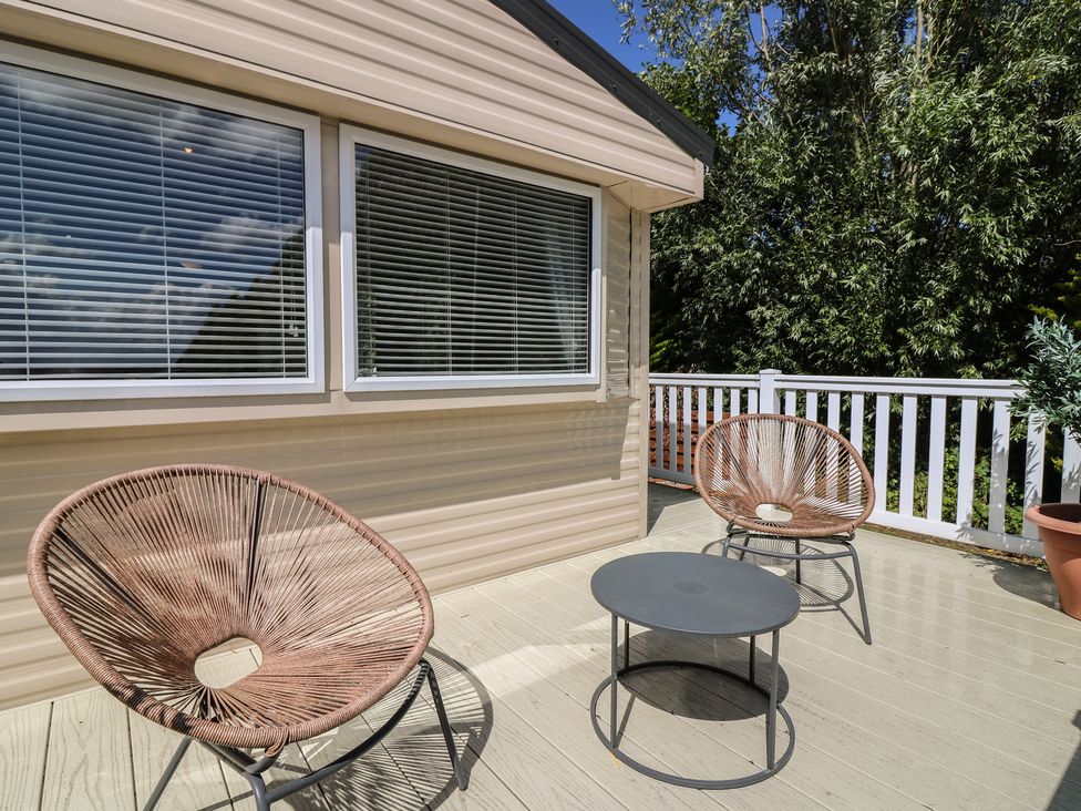 A deck with two chairs and a table at NO. 249 Eyemouth