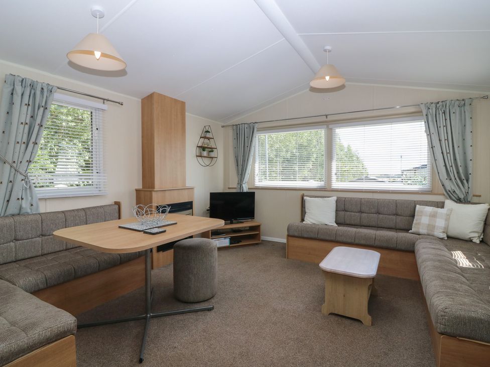 A living room with a sofa and coffee table at NO. 249 Eyemouth